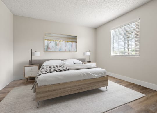 a bedroom with a bed and two nightstands